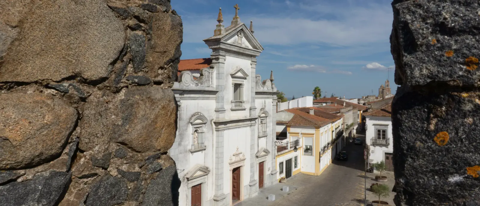 Beja’s cathedral and old streets seen through the castle battlements